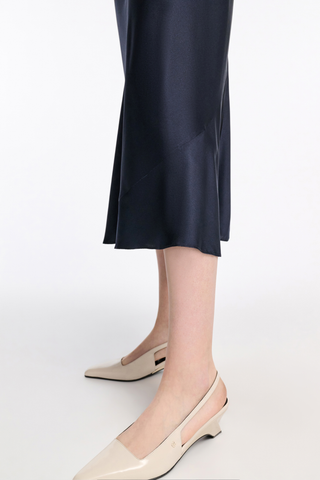 close up of hem cut for Sense Of Shine Skirt Navy silk satin midi length