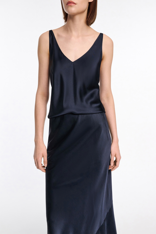 front profile model wearing Sense Of Shine v-neck cami Top Navy silk