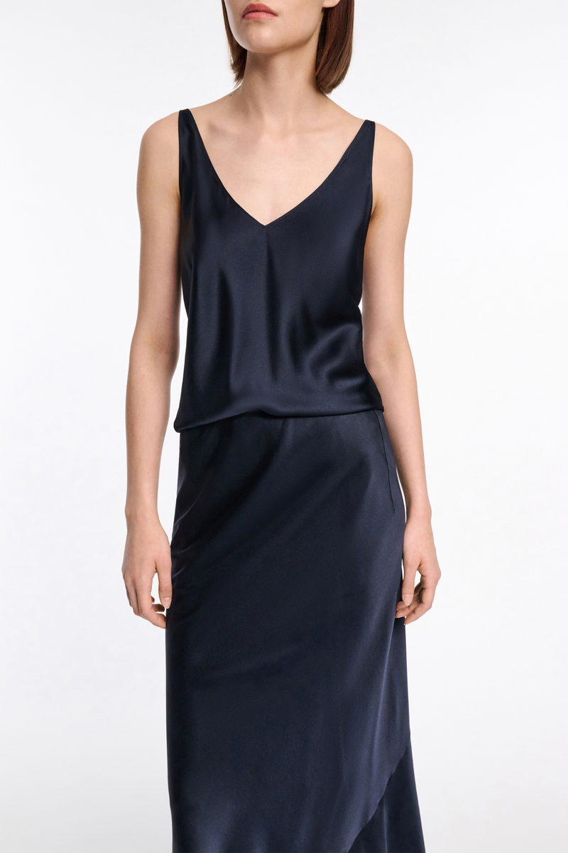 front profile model wearing Sense Of Shine v-neck cami Top Navy silk