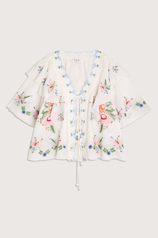 flat lay Serafina Embroidered Front Tie Embroidered short sleeve top
Intricate floral embroidery throughout
Flattering v-neckline
Scalloped edges
Self-tie closures
Tie front closure