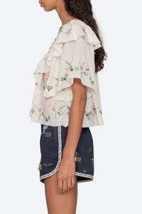 side profile model wearing Serafina Embroidered Front Tie Embroidered short sleeve top
Intricate floral embroidery throughout
Flattering v-neckline
Scalloped edges
Self-tie closures
Tie front closure