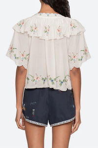 back profile model wearing Serafina Embroidered Front Tie Embroidered short sleeve top
Intricate floral embroidery throughout
Flattering v-neckline
Scalloped edges
Self-tie closures
Tie front closure
