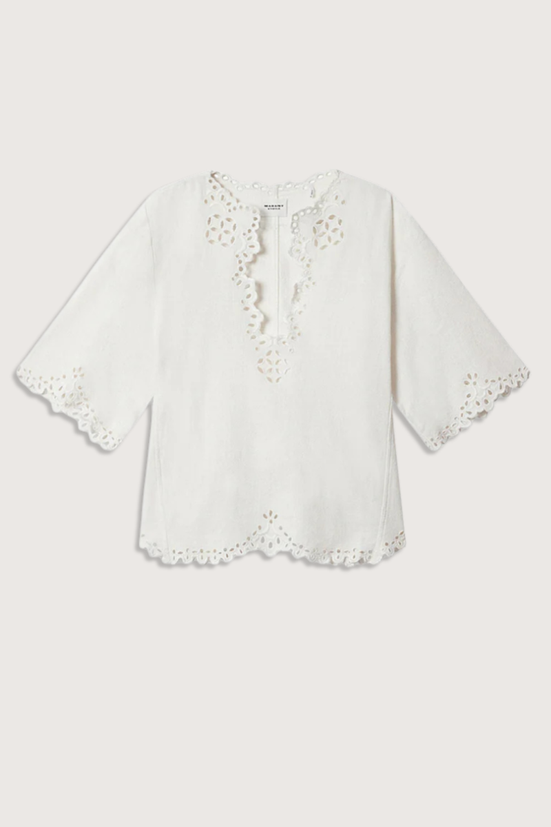 flat lay Shana Top white Tunic style top in soft openwork cotton
Tunisian neckline with broderie anglaise
Short flared sleeves with openwork cuffs
Flared openwork hem
100% cotton