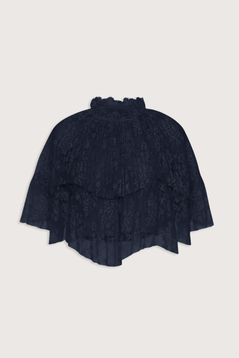 flat lay Sharleen Lace Cape Top navy Cape-style silhouette
Intricate floral lace
Subtle pleated detailing
Slightly cropped length
Asymmetrical hem
self-51% cotton, 49% polyester