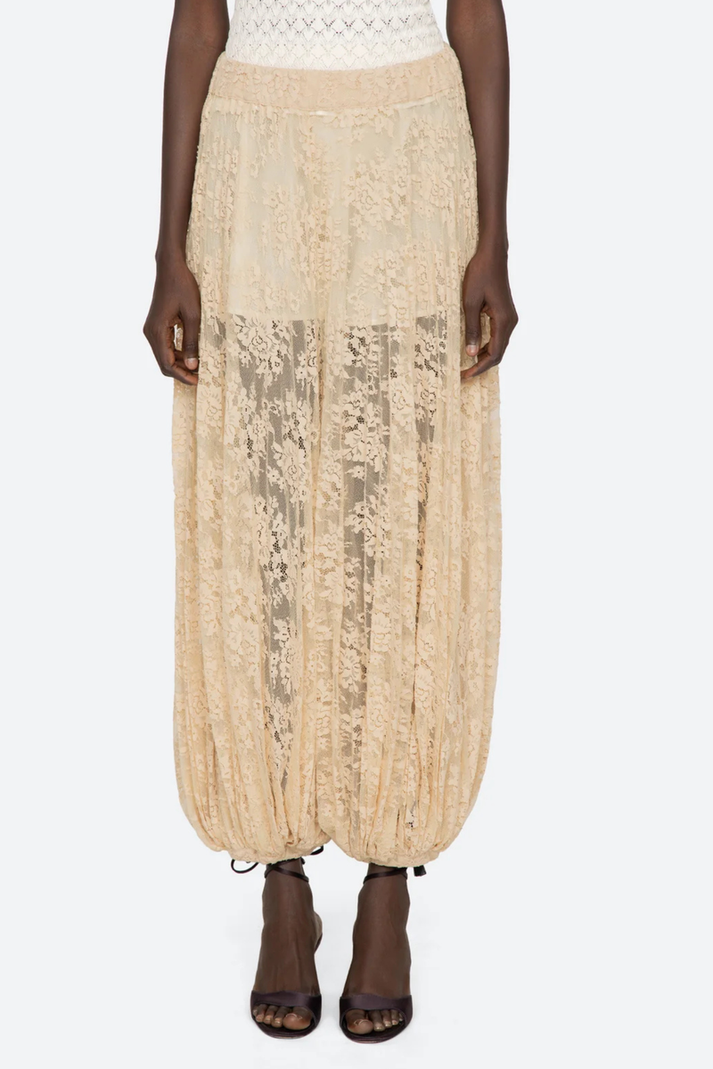 front profile model wearing Sharleen Lace Pant Khaki Voluminous balloon silhouette
Pleated
Comfortable elasticized waistband
Sheer floral lace
Self-51% cotton, 49% polyester
Slip on