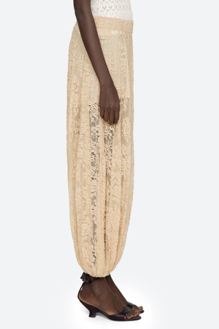 side profile model wearing Sharleen Lace Pant Khaki Voluminous balloon silhouette
Pleated
Comfortable elasticized waistband
Sheer floral lace
Self-51% cotton, 49% polyester
Slip on