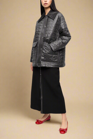 front pose model wearing the Shiny Quilt Midi Jacket in black with corduroy collar