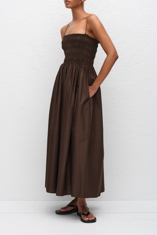side profile model wearing Shirred Bodice Midi Dress chocolate brown Pull-on dress
Cami style
Delicate shoulder straps
Repeated double elastic shirred detailing throughout the bodice
Mid-length style
Self-lined bodice
Side pockets
100% Organic Cotton Cami Dress