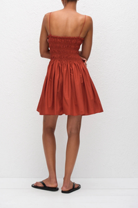 back profile model wearing Shirred Bodice Mini Dress tomato red Easy pull-on dress
Delicate shoulder straps
Repeated double elastic shirred detailing throughout the bodice
Side pockets
100% Organic Cotton Poplin