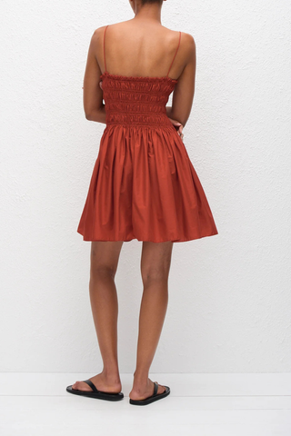 back profile model wearing Shirred Bodice Mini Dress tomato red Easy pull-on dress
Delicate shoulder straps
Repeated double elastic shirred detailing throughout the bodice
Side pockets
100% Organic Cotton Poplin