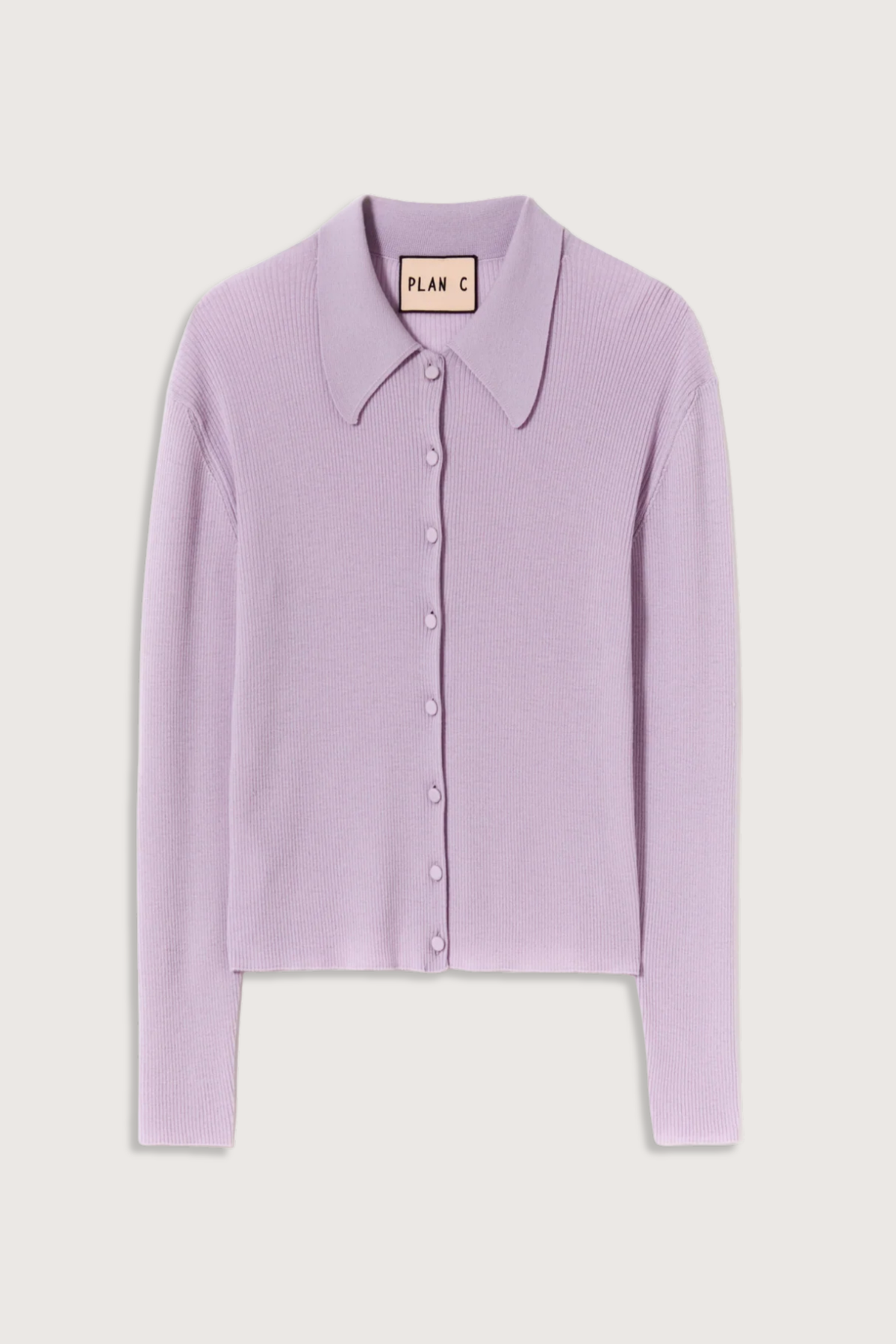 flat lay Shirt Collar Merino Wool Cardigan wisteria purple ribbed knit long sleeves cardigan in lightweight merino wool. Shirt collar and covered buttons.
100% merino wool