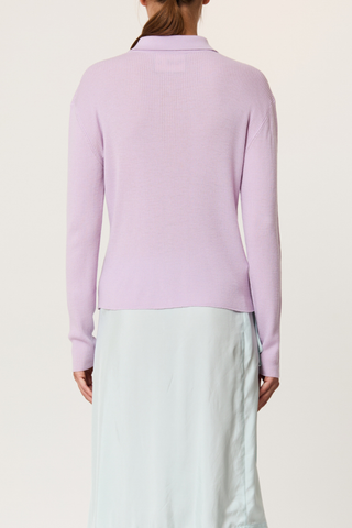 back profile model wearing Shirt Collar Merino Wool Cardigan wisteria purple ribbed knit long sleeves cardigan in lightweight merino wool. Shirt collar and covered buttons.
100% merino wool
