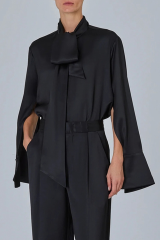 side profile model wearing  Shirt With Scarf Black Fluid blouse
Integrated neck scarf
Exaggerated cuffs
Clean hidden placket
Soft drape
57% silk 43% viscose