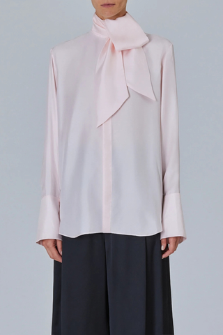 front profile model wearing Shirt With Scarf Light Pink Fluid blouse
Integrated neck scarf
Exaggerated cuffs
Clean hidden placket
Soft drape
57% silk 43% viscose