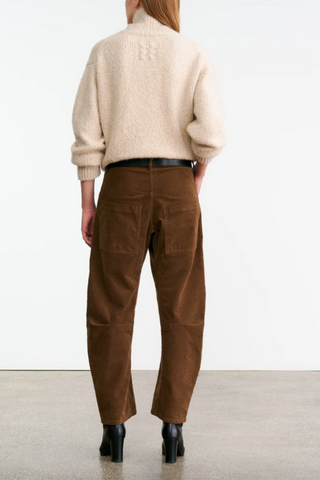 back profile model wearing Shon Corduroy Pant Caffe brown mid rise barrel leg with front utility pockets