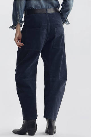 back profile model wearing Shon Corduroy Pant Service Blue Flat front
Mid-rise
Relaxed fit pant
Stretch corduroy
Curved silhouette
Easy tapered legs
Seam detail at knees
Zip fly with hidden hook and bar closure
Hidden button closure
Top-stitched front and back patch pockets
Belt loops
93% COTTON, 6% POLYESTER, 1% POLYURETHANE