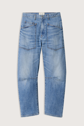 flat lay Shon Jeans Cienna Wash mid blue wash Mid-rise
Relaxed fit
Barrel leg jean
Uniquely curved silhouette
Seam detail at knees
Gusset at inseam
Zip fly
Shank closure
Top-stitched front and back patch pockets
Belt loops
100% Cotton