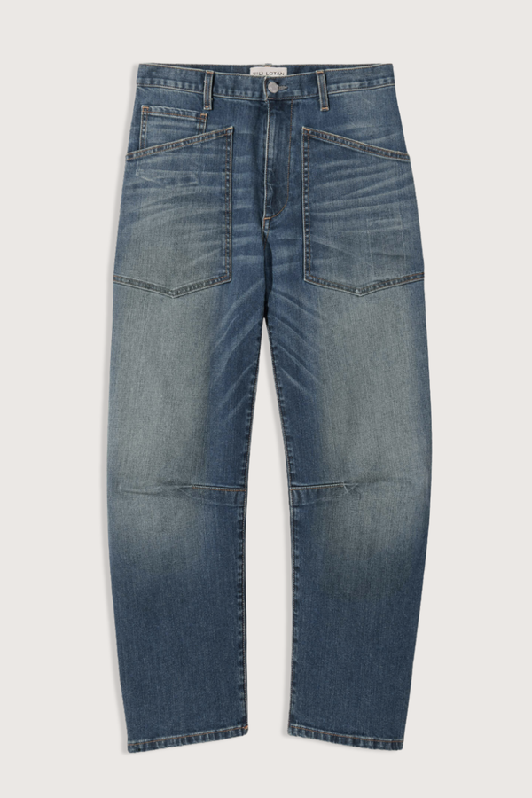 flat lay Shon Jeans Classic Wash mid wash blue Mid-rise
Relaxed fit
Barrel leg jean
 curved silhouette
Seam detail at knees
Gusset at inseam
Top-stitched front and back patch pockets
Belt loops
100% Cotton