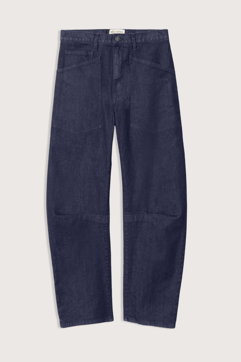 flat lay Shon Jeans Indigo Rinse cotton Mid-rise
Relaxed fit
Barrel leg jean
Uniquely curved silhouette
Seam detail at knees
Gusset at inseam
Zip fly
Shank closure
Top-stitched front and back patch pockets
Belt loops