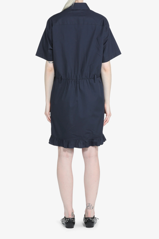 back profile model wearing Short Sleeve Poplin Dress Blue navy cotton Navy blue shirt dress
Classic collar
Short sleeves
Button-up front
Shirtdress style
Elastic waistband
Hem is finished with a ruffle
Above-the-knee length
