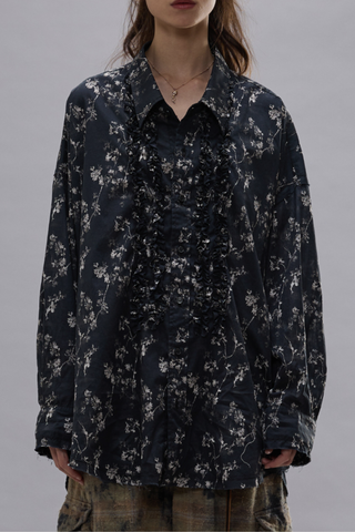 front profile model wearing Shredded Seam Ruffle black Shirt Oversized
Shredded seam shirt
Ruffled placket built from printed Italian crinkle cotton gauze