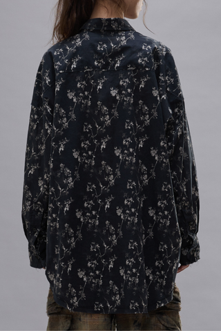 back profile model wearing Shredded Seam Ruffle black Shirt Oversized
Shredded seam shirt
Ruffled placket built from printed Italian crinkle cotton gauze