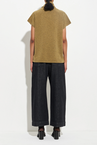 back profile model wearing Sleeveless Wrap Top With Scarf wool cashmere olive Built-in scarf that drapes and wraps effortlessly around the neckline, Soft shoulder line