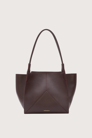 front profile Small Victoria Soft Calf Leather Tote burgundy Tonal suede lining
Unstructured silhouette
Minimal hardware
Discreetly decorative V-stitched panels