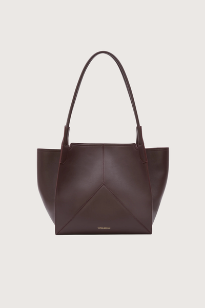 front profile Small Victoria Soft Calf Leather Tote burgundy Tonal suede lining
Unstructured silhouette
Minimal hardware
Discreetly decorative V-stitched panels