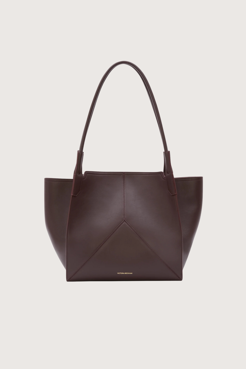front profile Small Victoria Soft Calf Leather Tote burgundy Tonal suede lining
Unstructured silhouette
Minimal hardware
Discreetly decorative V-stitched panels