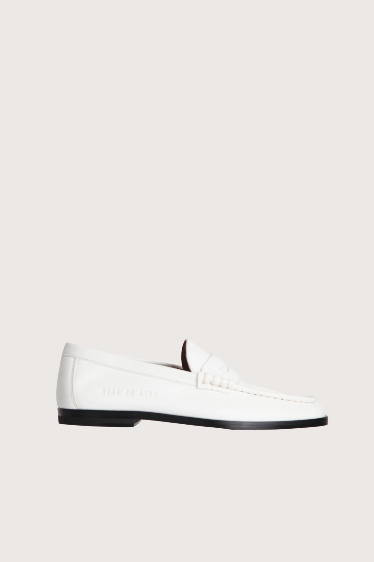 side profile soft leather loafer white traditional penny strap
Leather upper and lining Wide signature side number on the side