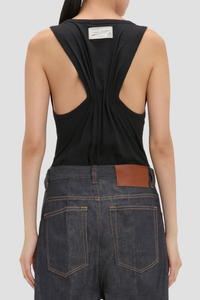 back profile model wearing Split Tank Top Black cotton linen vest top
Rounded square neckline
Cut-out detail
Low hip length
Cotton blend
Sleeveless
Pleated back
