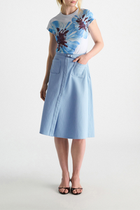 front profile model wearing Sporty Chic Cotton Skirt mineral blue 100 % Cotton
Cotton skirt
Belted waist
Center front slit
Faux front button placket
Patch pockets
In-seam side zip closure
Unlined