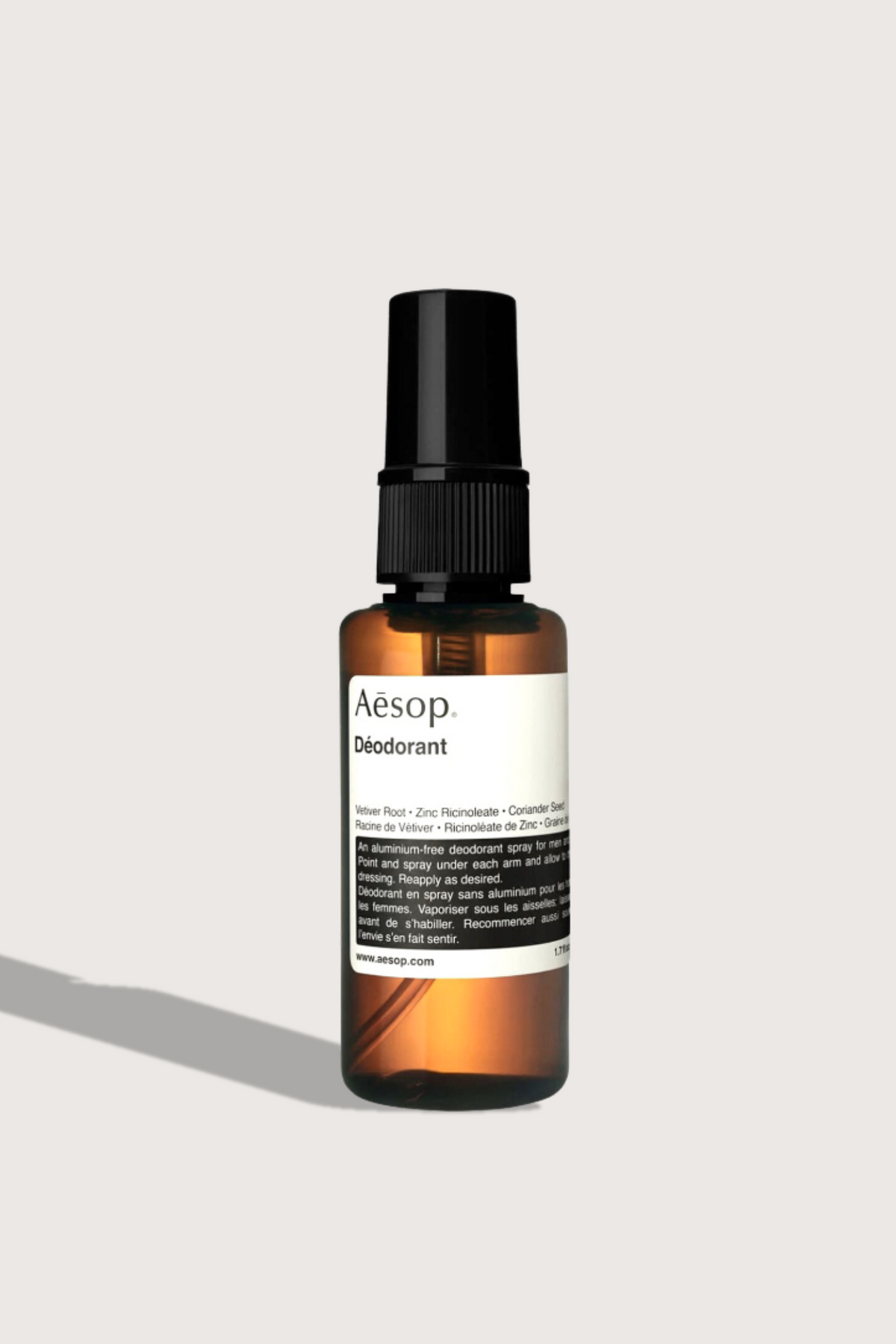 flat lay Spray Deodorant brown bottle with spray and cap