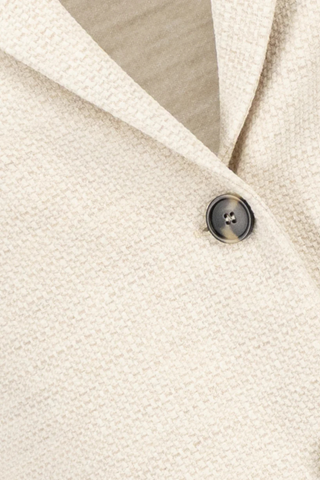 close up texture detail and button detail of Stand Collar Blazer Cream Boyfriend blazer
Unlined
Knitted hopsack
Loro Piana fabric
Stand-up collar blazer
Boxy shape
Fitted long sleeve
Patch pockets
2-button fastening plus 1 collar button for full closure