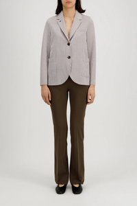 front profile model wearing Stand Collar Blazer Tobacco/White Boyfriend blazer
Unlined in knitted coolmax seersucker
Stand-up collar blazer
Boxy shape
Fitted long sleeve
Patch pockets
2-button fastening
1 collar button for full closure
Raw-edge finish
Made in Italy with Japanese fabric
Seersucker Blazer
65% Cotton, 35% Polyester