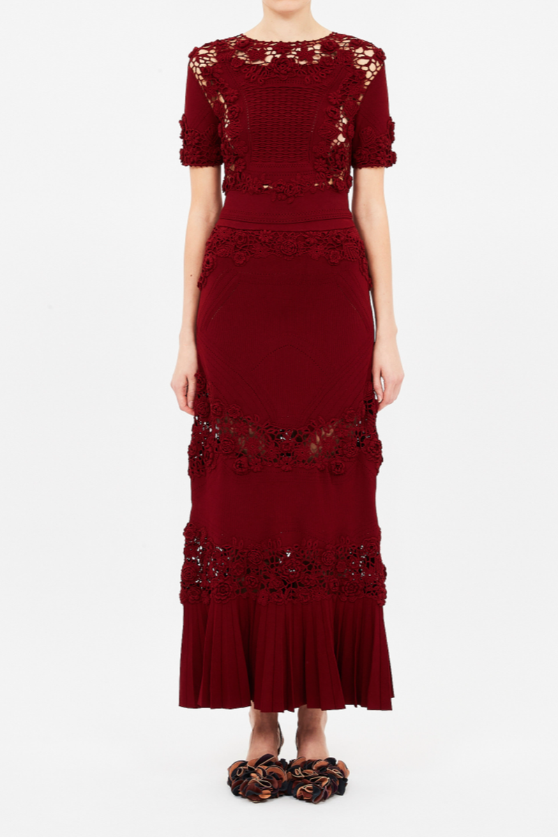 front profile model wearing Stella Short Sleeve Floral Crochet Knot Knit Top begonia red