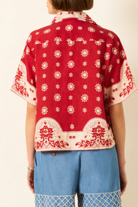 back profile model wearing Stevie Lava Bandana Camp collar linen Shirt red boxy with french seams
