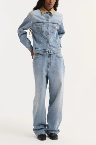 front profile model wearing Suede Collar Denim Jacket classic blue light wash Classic fitted denim jacket
Contrasting suede collar
Chest pockets
cotton