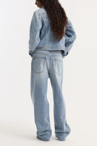 back profile model wearing  Suede Collar Denim Jacket classic blue light wash Classic fitted denim jacket
Contrasting suede collar
Chest pockets
cotton