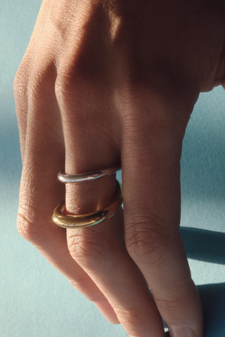 model wearing  Surma Ring Vermeil / Silver –Yellow vermeil 18 karats and 925 Rhodium Plated Sterling Silver Double loop with crosses in the back