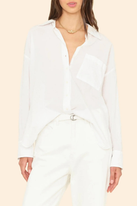 front profile model wearing Sydney Boxy Cotton Shirt White cotton poplin long sleeve Oversized button-down shirt with a left chest patch pocket