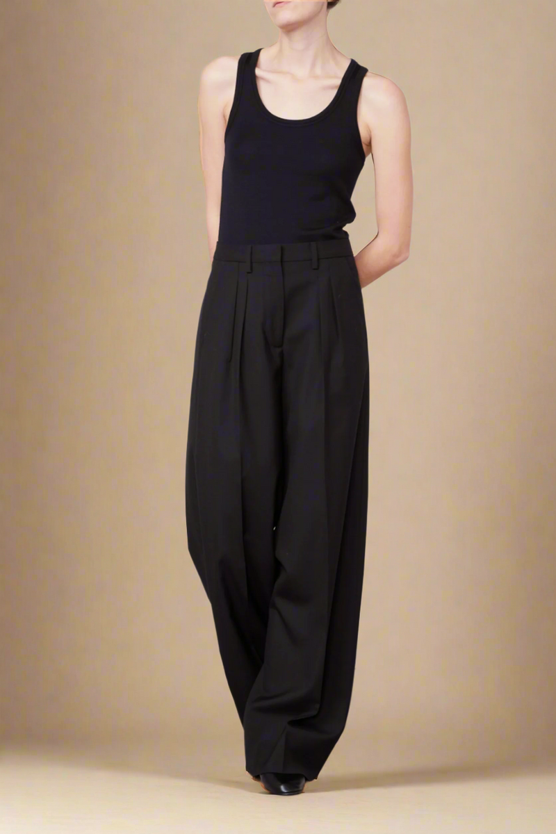 front profile model wearing Tatia Wool Black tank