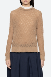 front profile model wearing Soft alpaca wool at the front
Intricate embroidery on the back
Delicate ruffle at the collar
Ribbed-knit trim at the cuffs and hem
Self-55% alpaca, 45% polyamide
combo-100% cotton
Button back closure