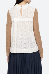 back profile model wearing Soft alpaca wool at the front
Intricate embroidery on the back
Delicate ruffle at the collar
Ribbed-knit trim at the cuffs and hem
Self-55% alpaca, 45% polyamide
combo-100% cotton
Button back closure