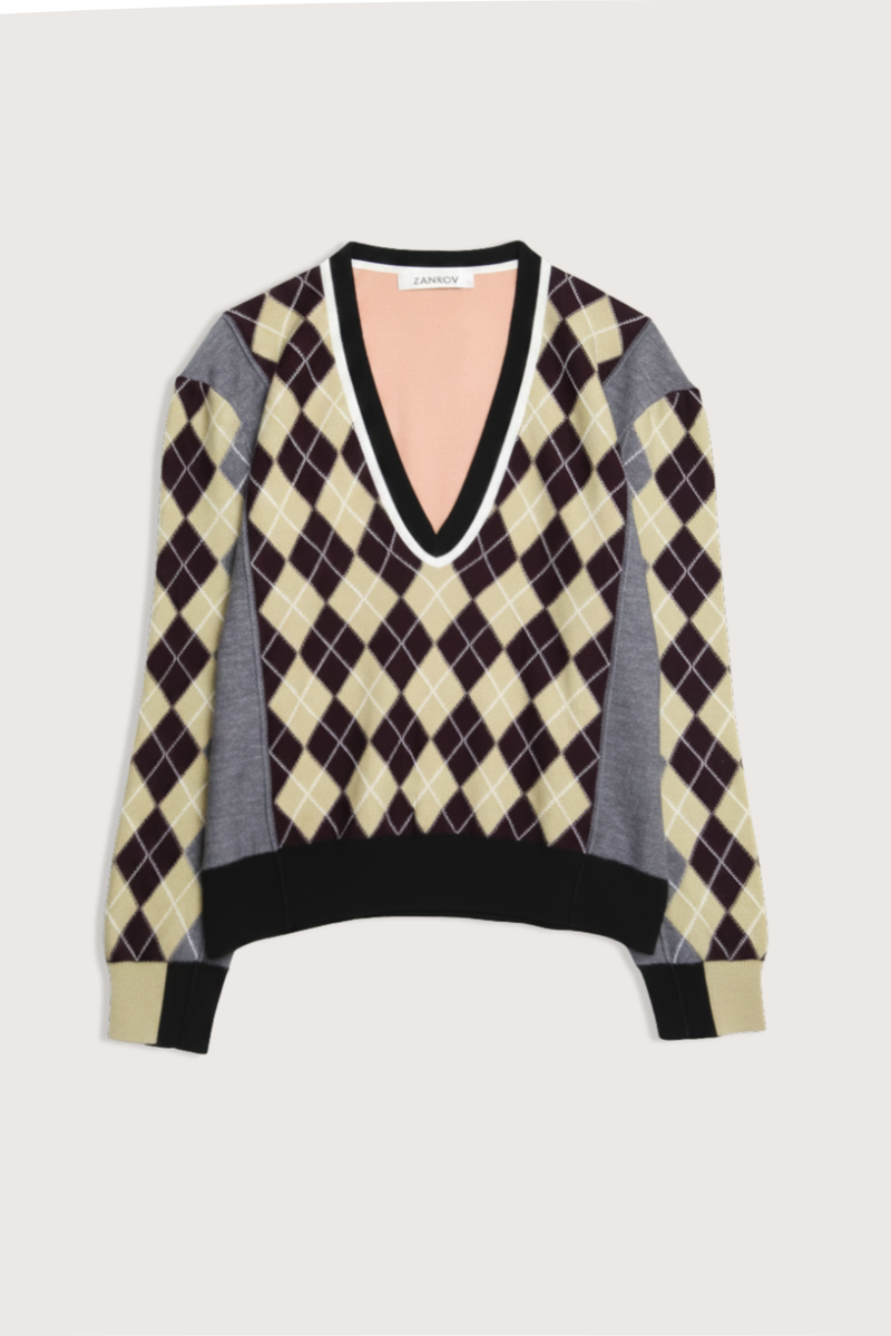 flat lay Teddy Reverse Argyle V-Neck Sweater grey/yellow/pink multi 100% Laine wool
Deep v-neckline
Argyle print throughout
Contrast solid color on hem and side sleeves and collar area
Long sleeves
Relaxed fit