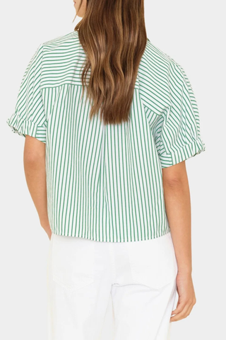 back profile model wearing  Teddy Short Sleeve Top green white stripe Crisp multicolor stripe cotton
Cropped button-front
Boxy fit
Rolled sleeves
Back yoke
100% Cotton