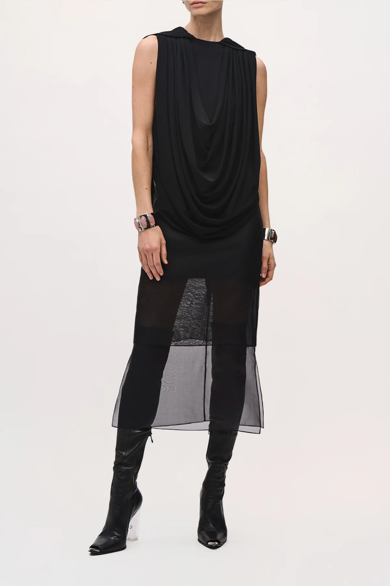 front profile model wearing The Astor Draped Jersey Top Black 
Cascading folds
Sleeveless
Deep cowl-neck draping
Fitted silhouette through the waist
100% Viscose Jersey