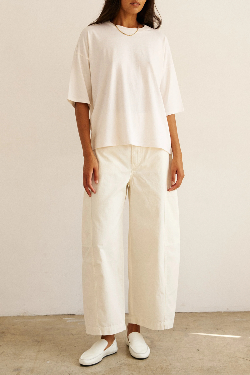 front profile model wearing The Baggy Painter Crop Pant ecru 
Inset patch pockets
Japanese Cotton Twill
Garment dyed 