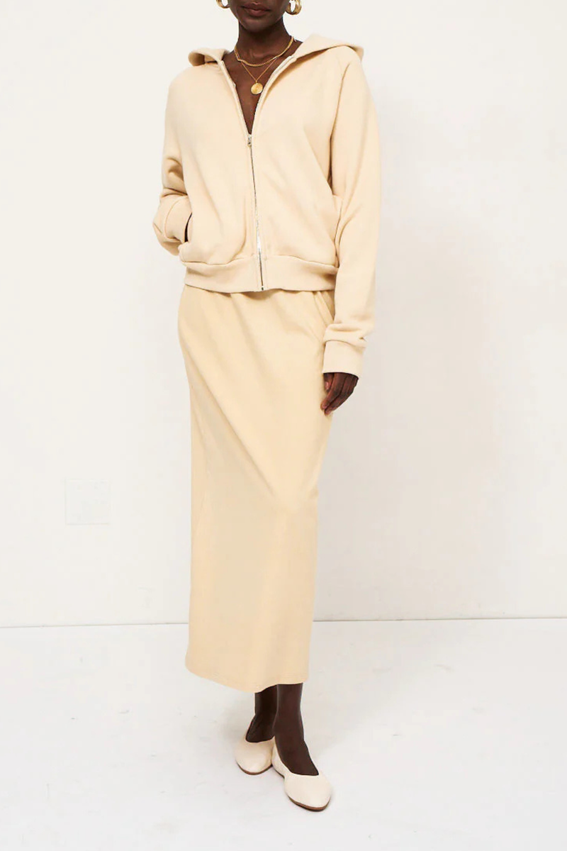 front profile model wearing The Birdie Hoodie butter yellow cotton Luxurious Japanese french terry lining
Piece dyed for a saturated hue that maintains it’s color
Relaxed fit